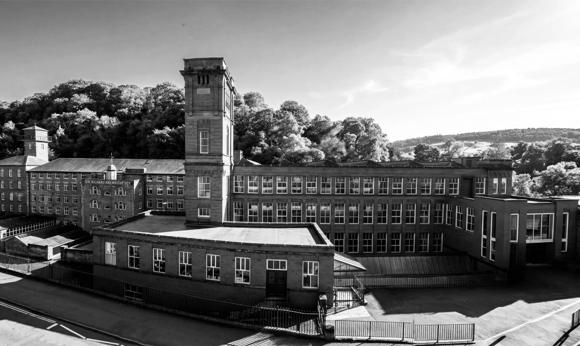 A wide view across the Masson Mills complex and surrounding landscape